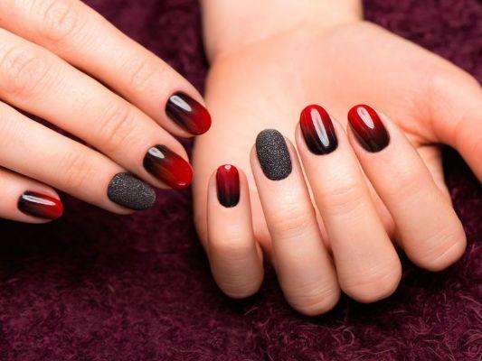 Create a stunning gradient effect with crimson and black nails