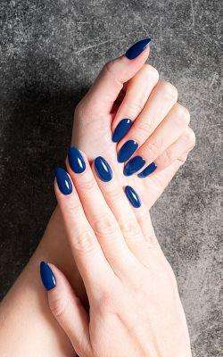 Matching your nails to your dress with deep navy polish