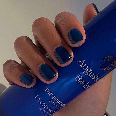 Sapphire blue nails coordinate beautifully with a dark blue dress