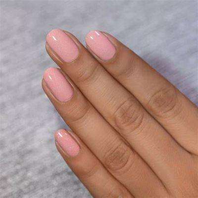 Soft peachy pink nails are sweet and feminine