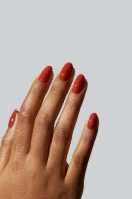 Terracotta nail polish evokes warmth and rustic charm