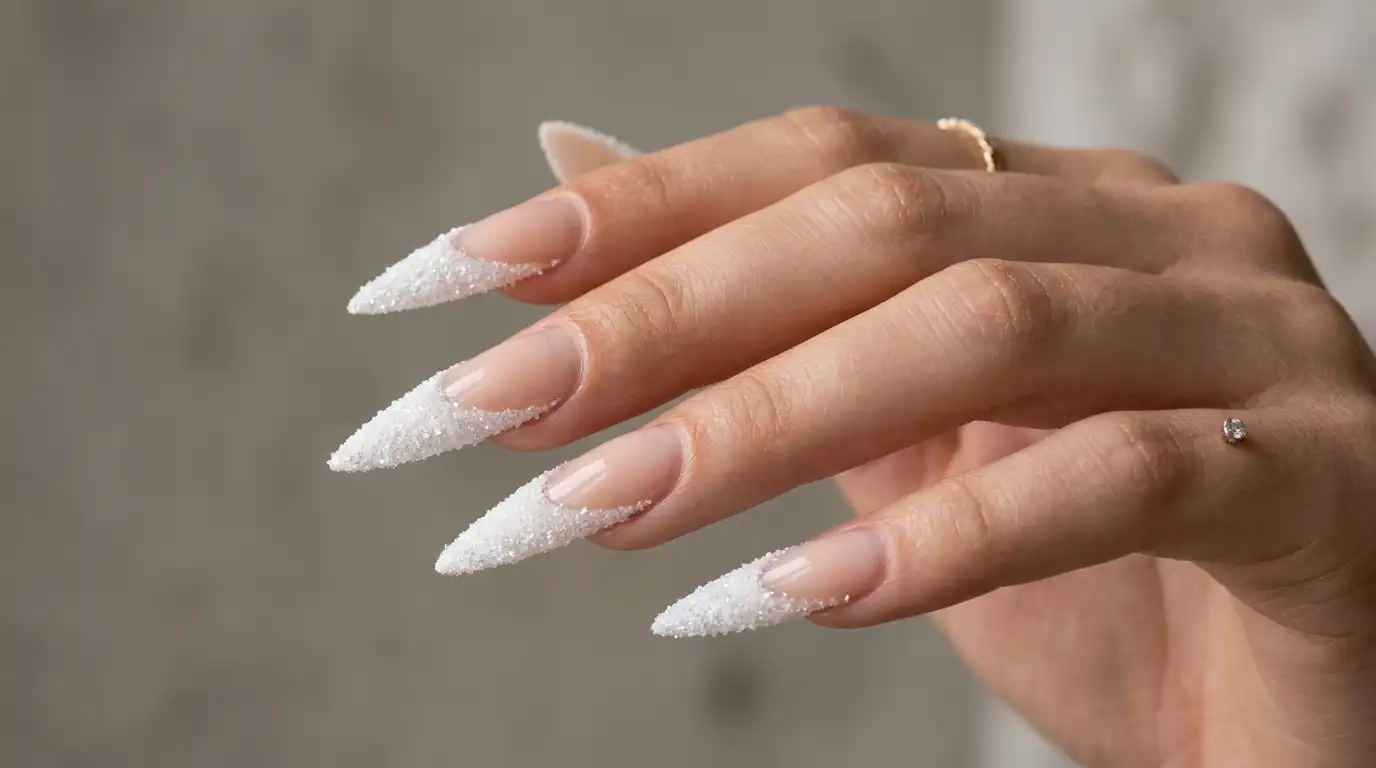 Long stiletto nails with a dramatic frosted white tip